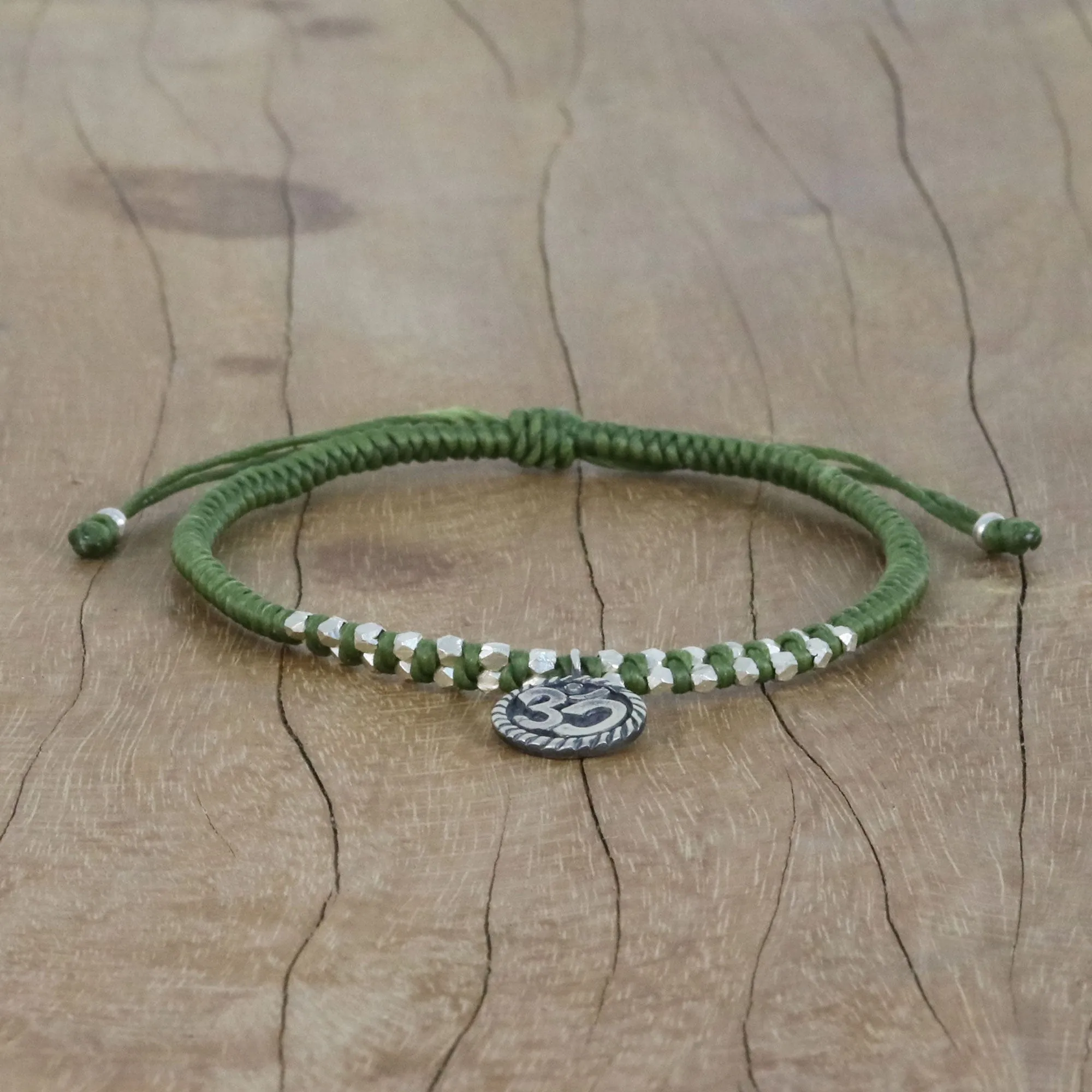 Ancient Om in Green Silver Om Charm Bracelet on Braided Green Cords