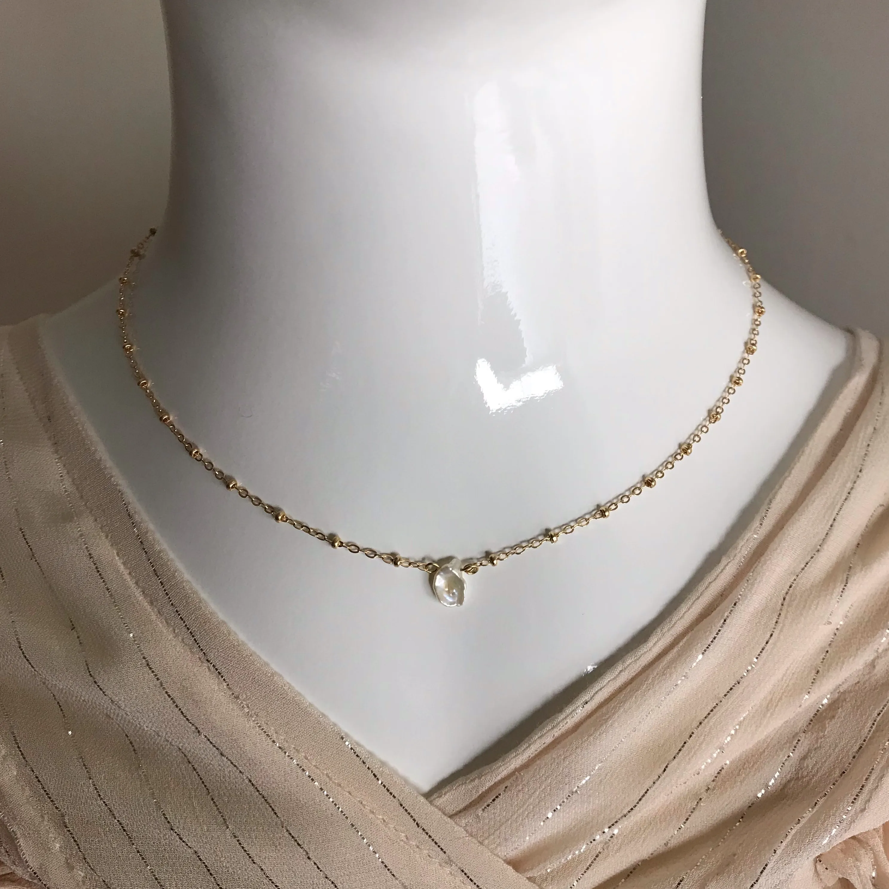 Side to Side Gold Pearl Necklace