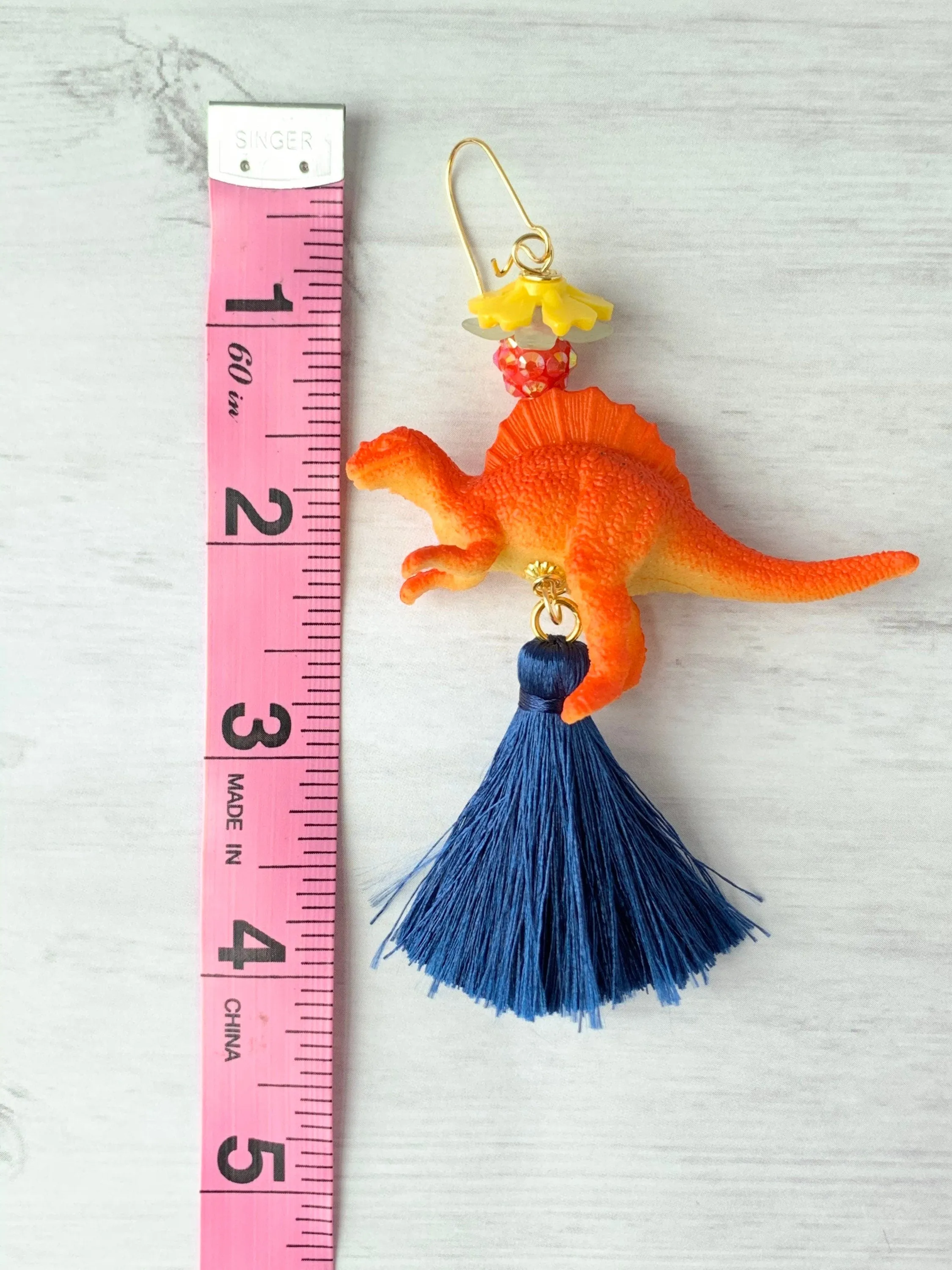 Tangerine Spinosaurus Tassel Earrings