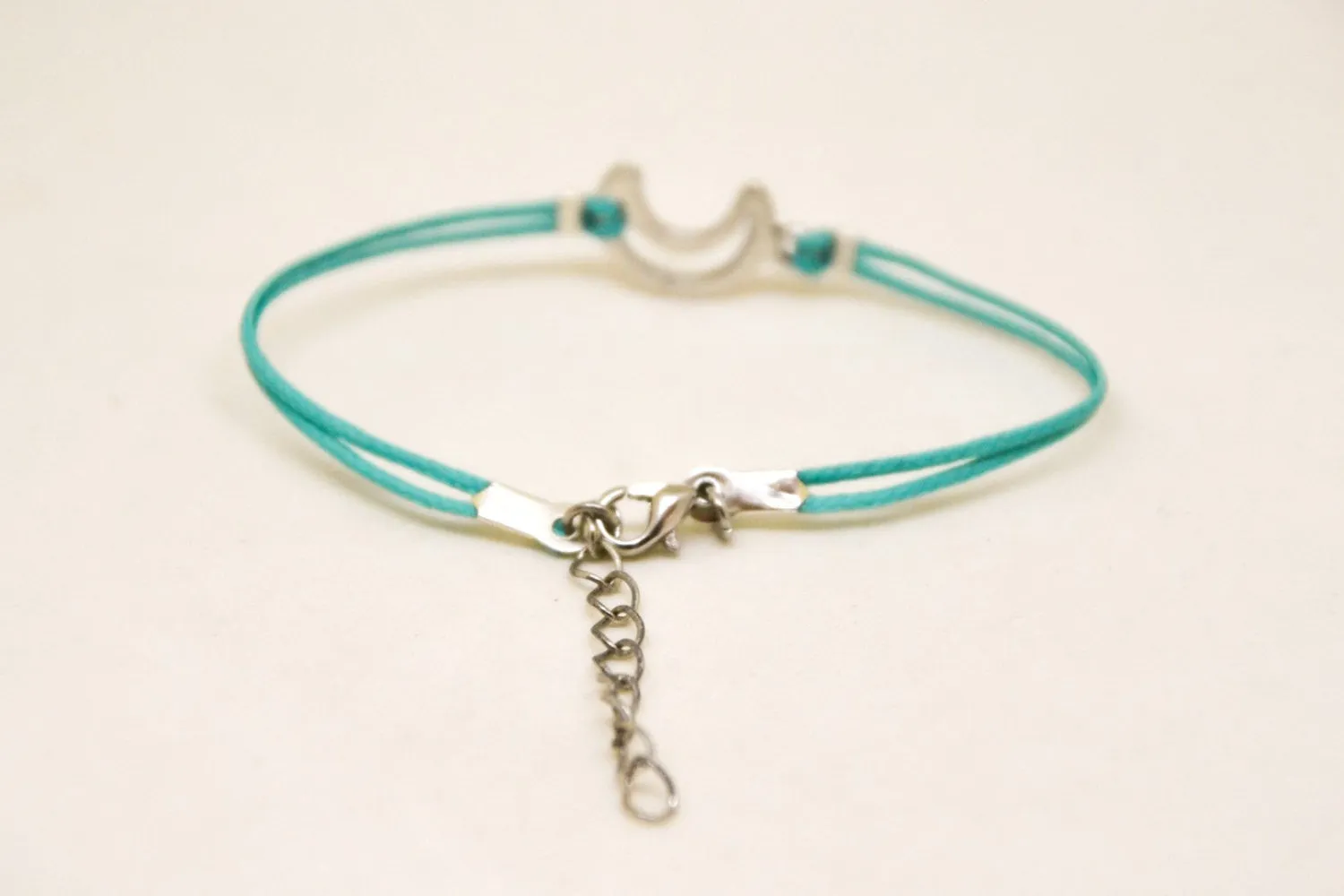 Turquoise cord bracelet with a silver crescent moon charm, gift for her