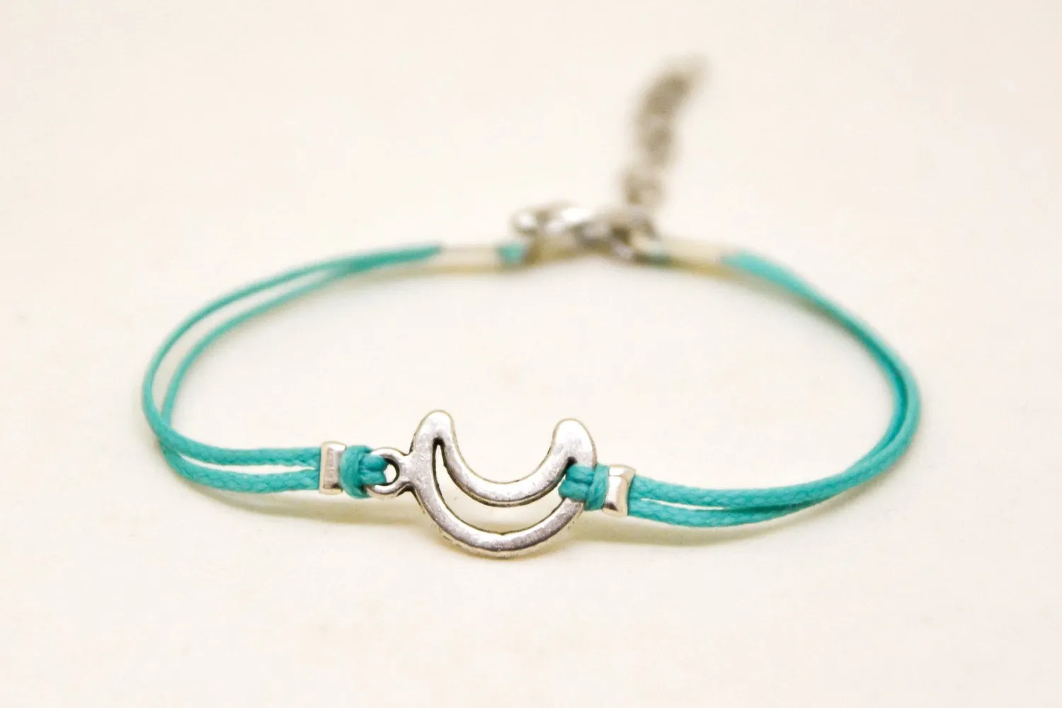 Turquoise cord bracelet with a silver crescent moon charm, gift for her