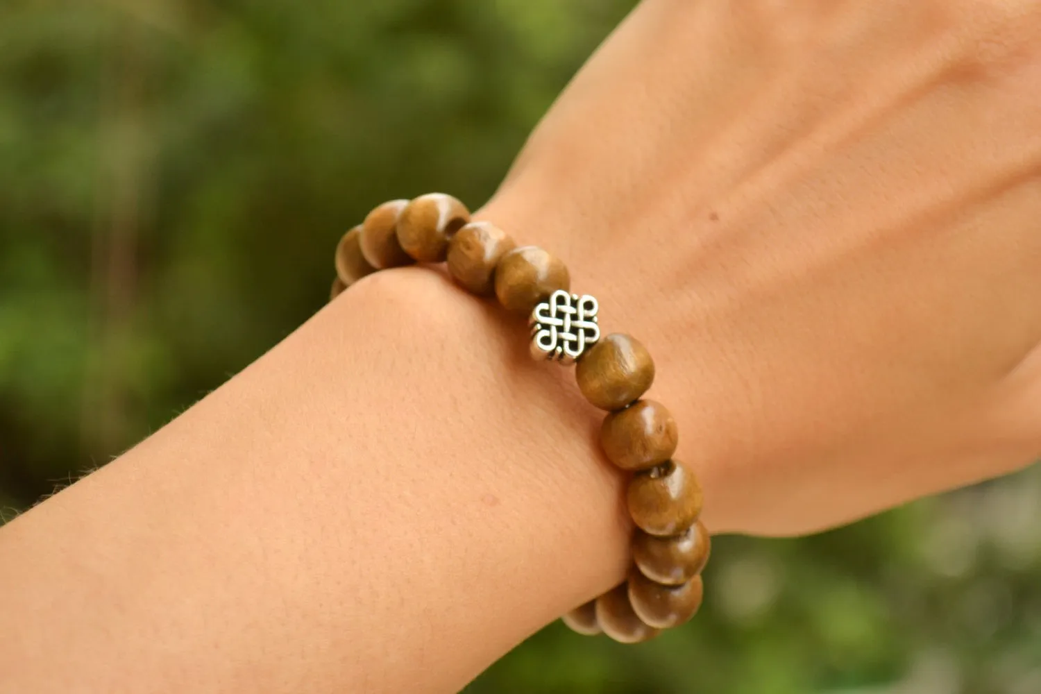 Wood beads stretch bracele with silver celtic endless knot charm